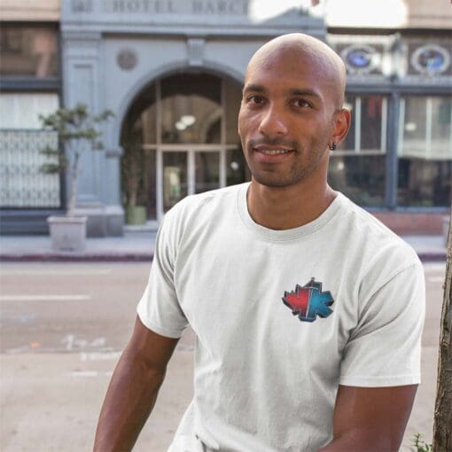 Man wearing EMS T-shirt sitting on street planter